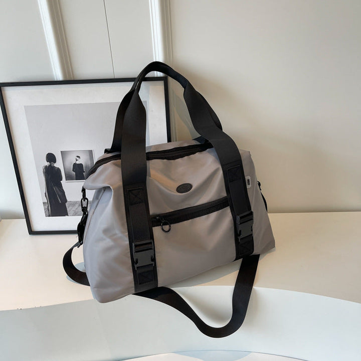 Spacious sports duffel bag with ergonomic carrying handles and water-repellent material Kalsten