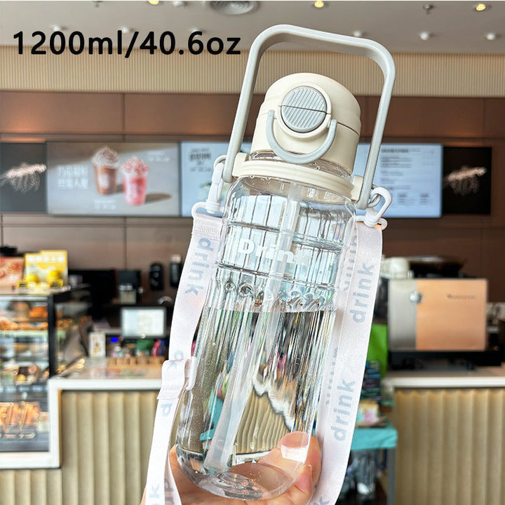 Women's large transparent drinking bottle with integrated carrying handle Kalsten