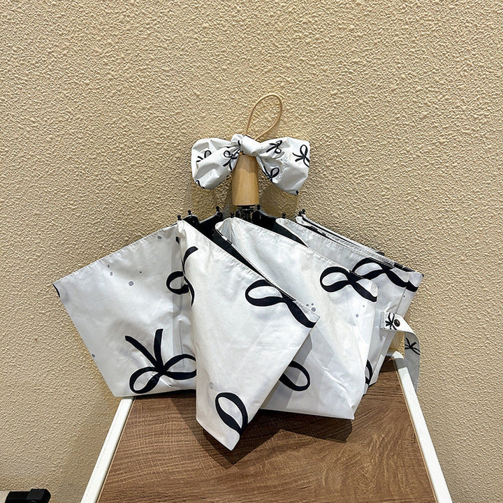 Women's foldable umbrella with elegant bow design Kalsten