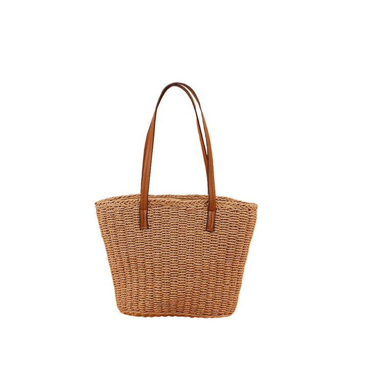 Handbag made of hand-woven natural material with sturdy leather handles Kalsten