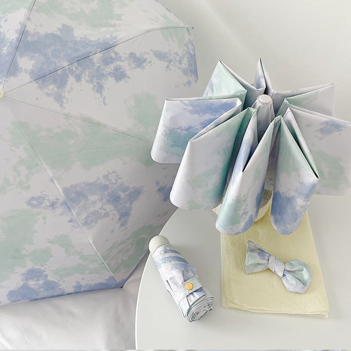 Ladies elegant folding umbrella with modern cloud pattern Kalsten
