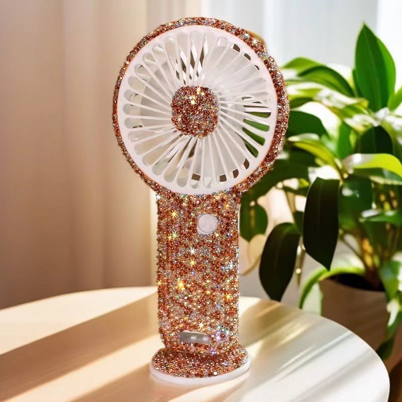 Women's portable hand fan rechargeable with rhinestone accents and cat emblem Kalsten