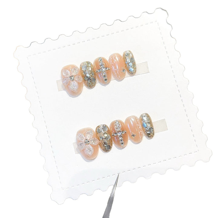 Glamorous artificial nails with floral and glittering accents Kalsten