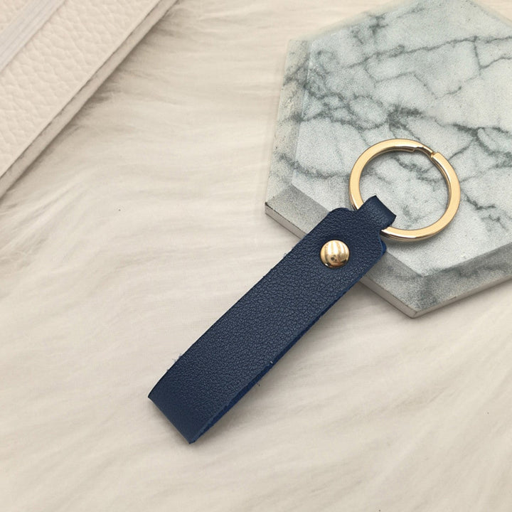 Unisex keychain made of high-quality synthetic leather with elegant metal embellishment Kalsten