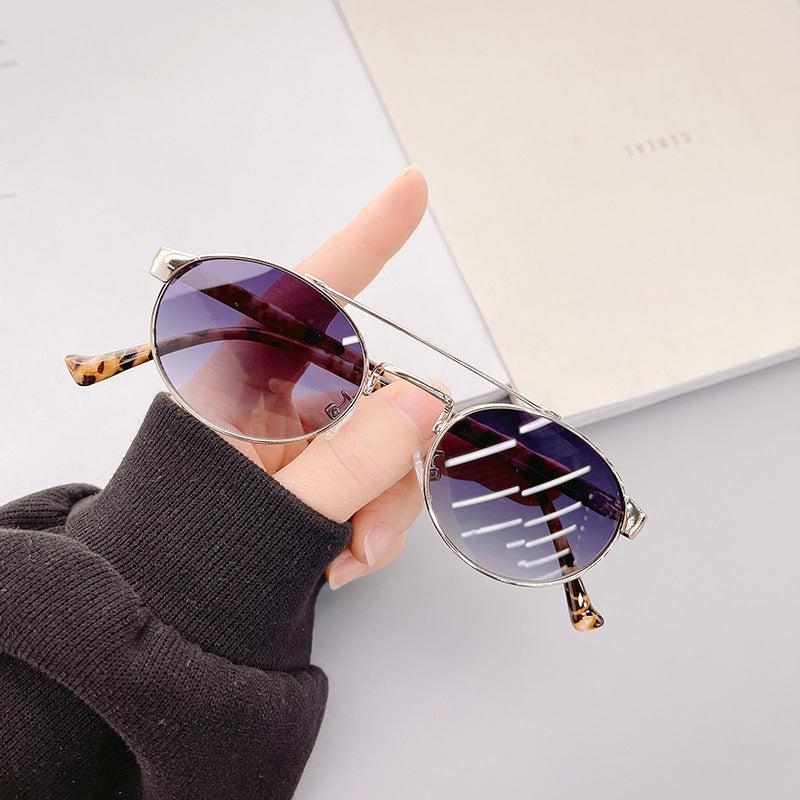 Ladies fashionable sunglasses in stylish round design with golden accents Kalsten