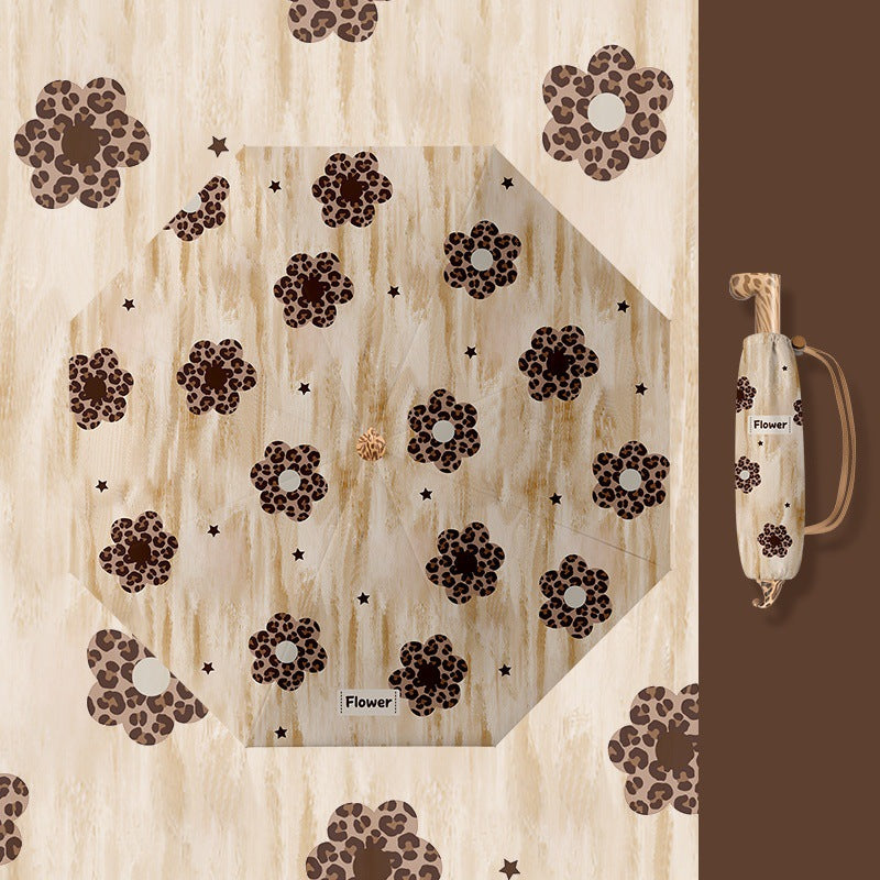 Ladies folding umbrella with playful design Kalsten