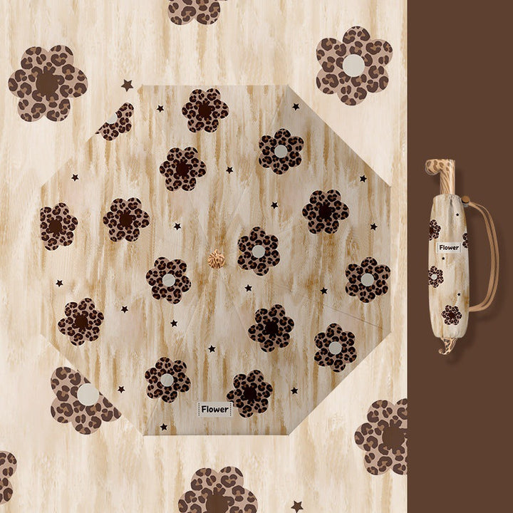 Ladies folding umbrella with playful design Kalsten
