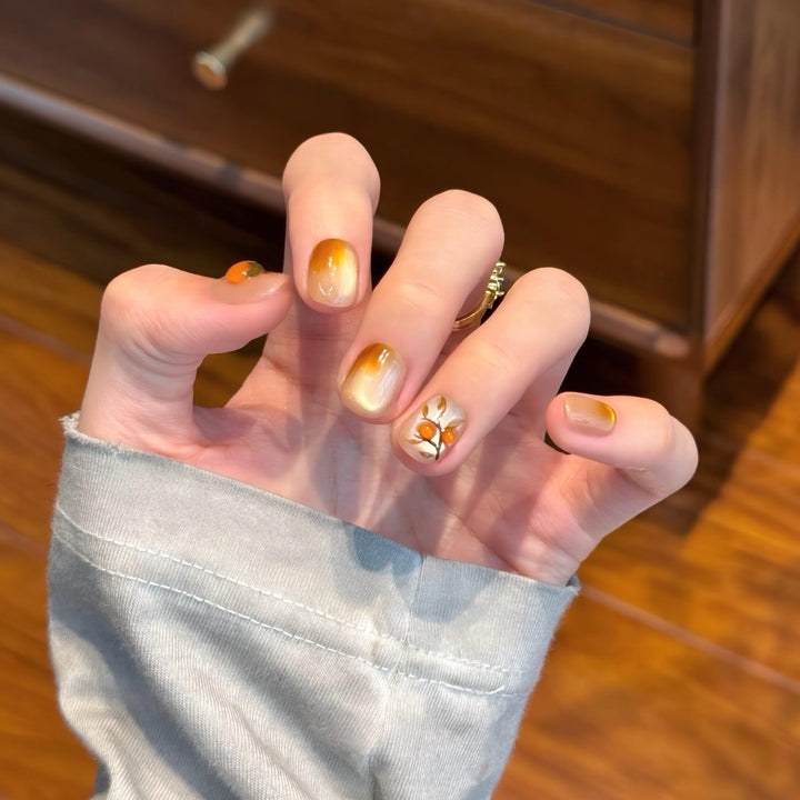 Artificial nails in elegant ombre look with floral accent Kalsten