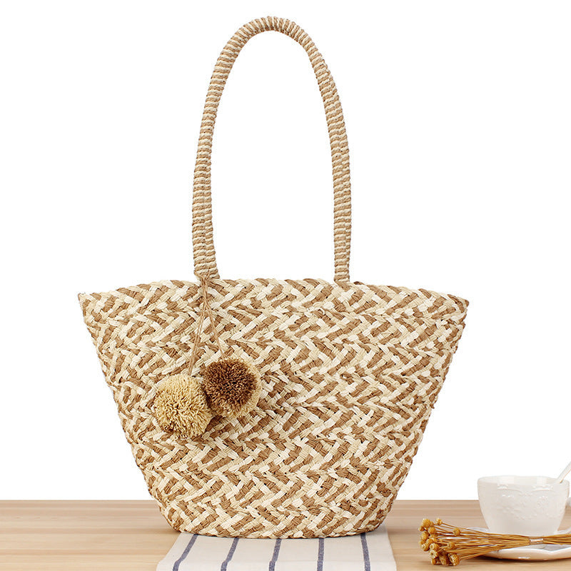 Summer wicker handbag with pom poms Kalsten