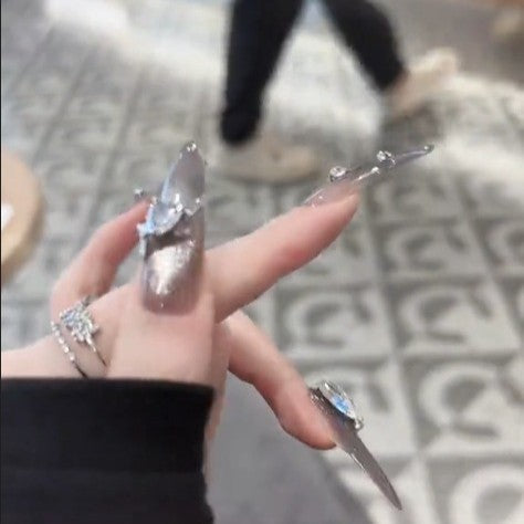 Glamorous artificial nails with rhinestone accents Kalsten