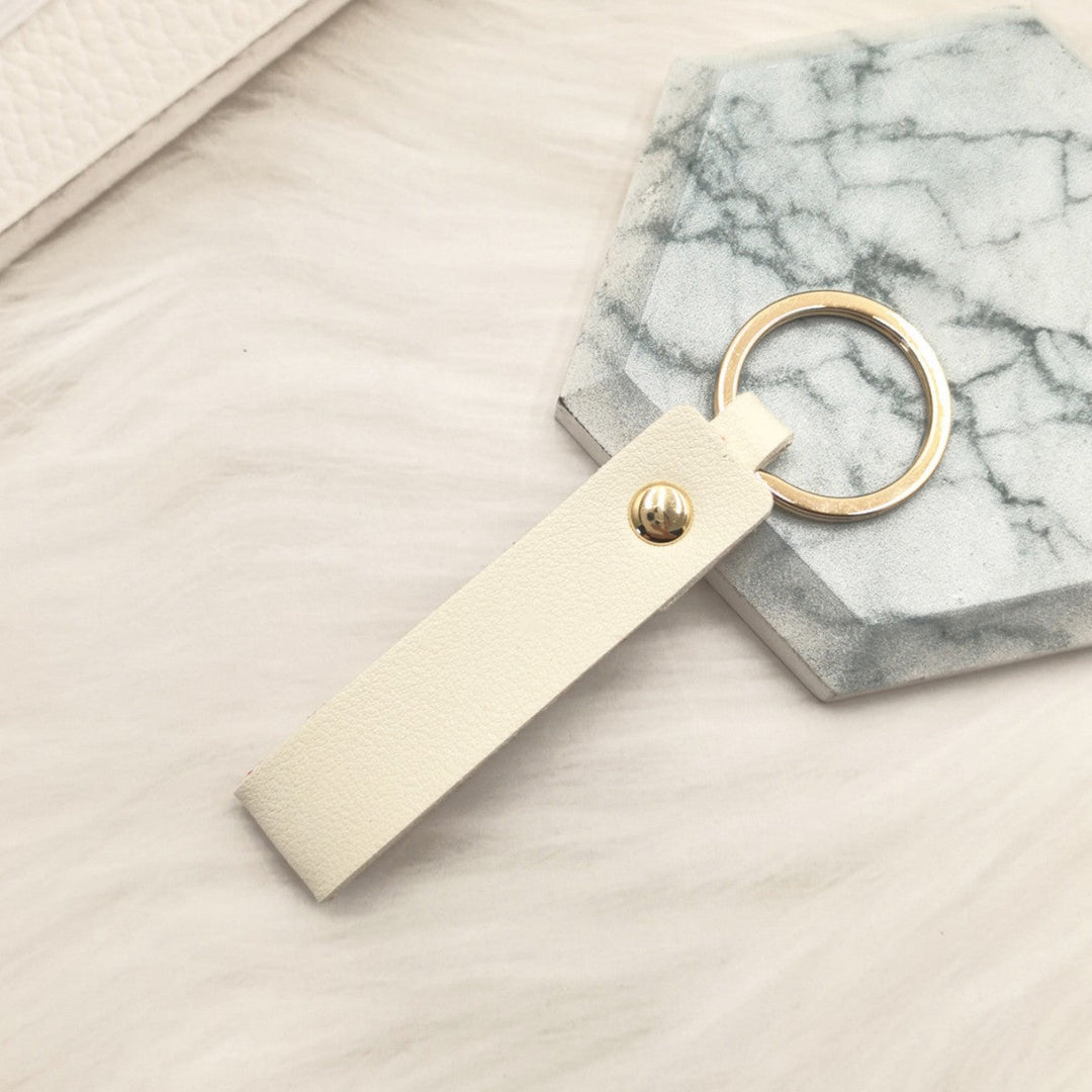 Unisex keychain made of high-quality synthetic leather with elegant metal embellishment Kalsten