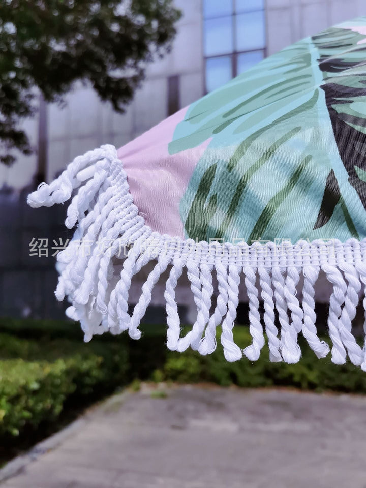 Ladies sun umbrella with tropical leaf design and tassel decoration Kalsten