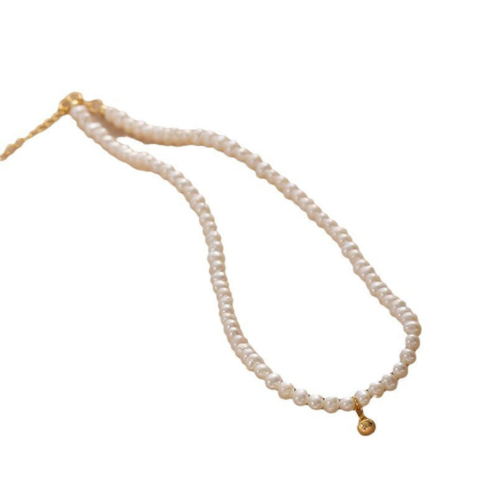 Delicate pearl necklace with elegant gold accent chain Kalsten