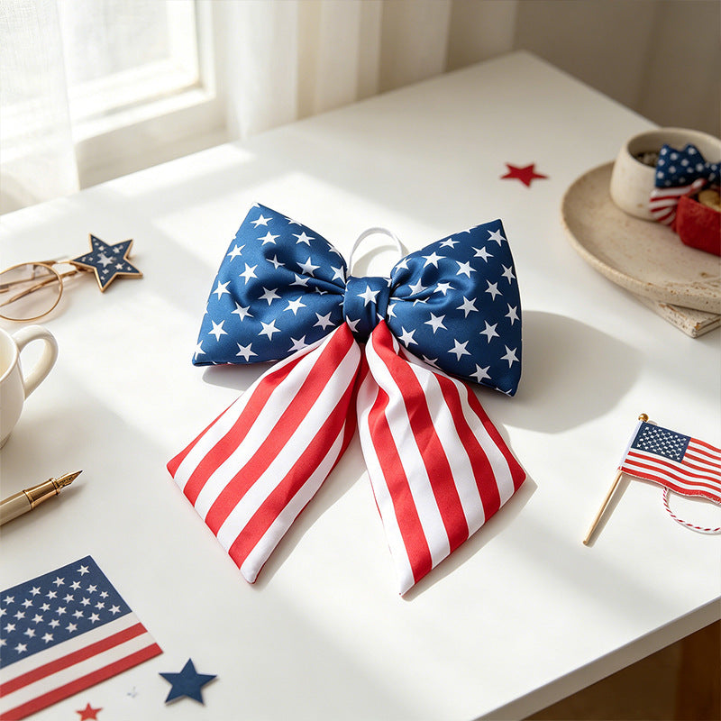 Women with large bow hair clip featuring patriotic star stripe motif Kalsten