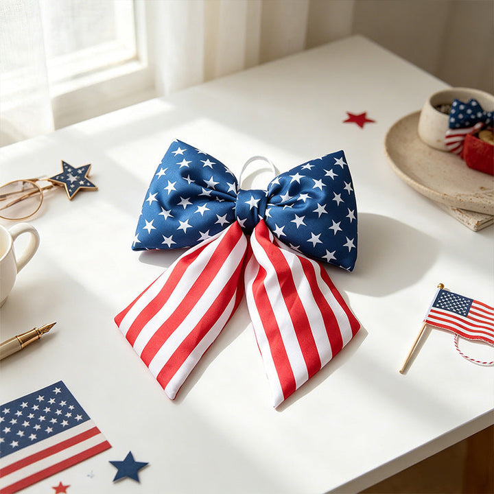 Women with large bow hair clip featuring patriotic star stripe motif Kalsten