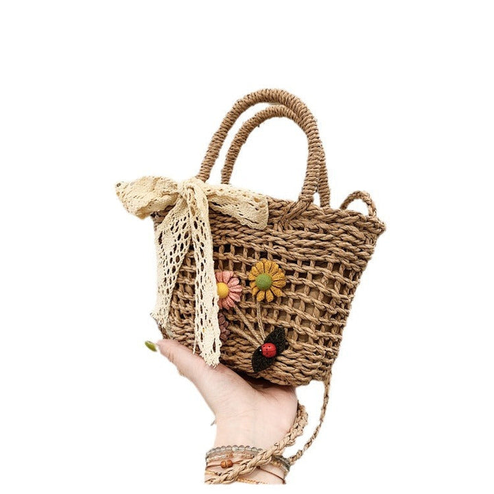 Playful basket bag with floral appliqués Kalsten