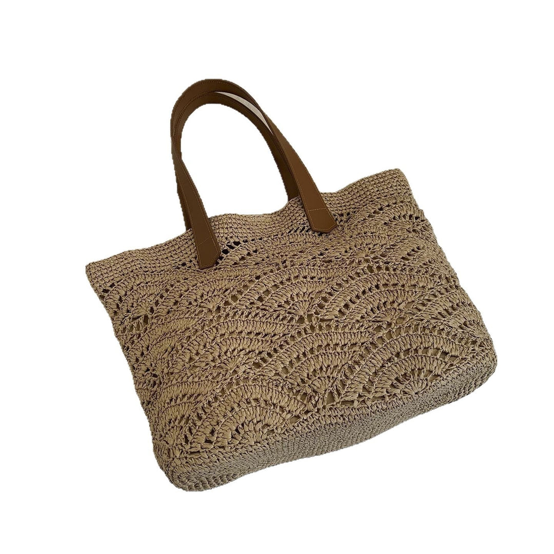 Handbag made of high-quality woven natural material with elegant leather handles Kalsten