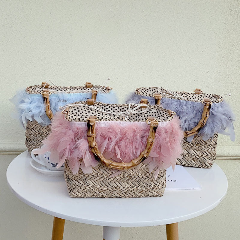 Elegant handbag with feathers and bamboo handles Kalsten