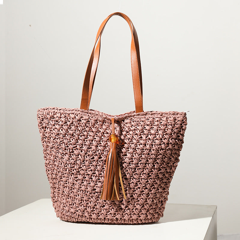 Handcrafted basket bag with fashionable tassel detail Kalsten