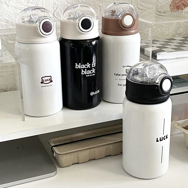 Women's insulated drinking bottle with innovative flip lid and practical handle Kalsten