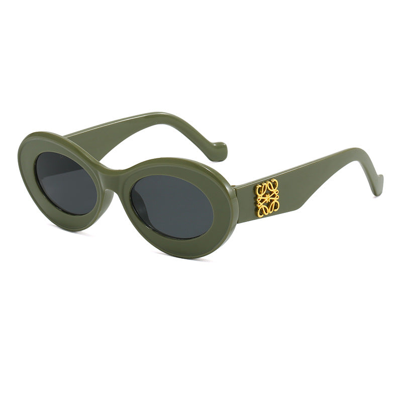 Women's fashionable sunglasses with oval frame and golden applications Kalsten
