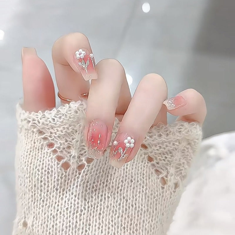 Artificial nail set with floral designs and glitter accents Acalora