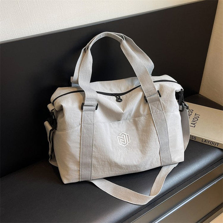 Sporty tote bag with multiple compartments and adjustable straps Kalsten