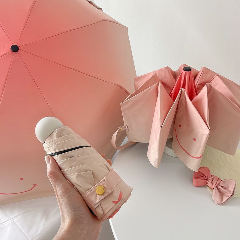 Women's foldable umbrella with playful design and handy wooden handle Kalsten