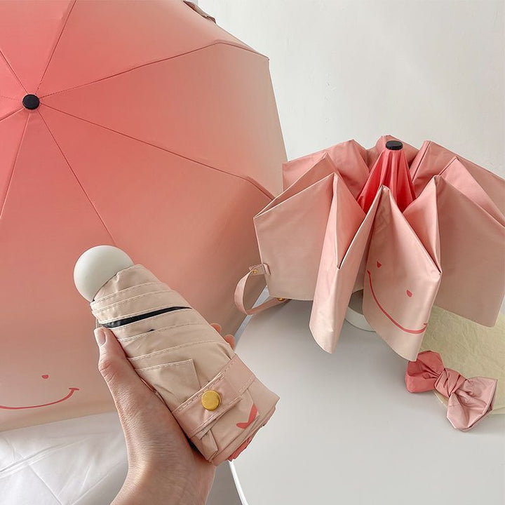 Women's foldable umbrella with playful design and handy wooden handle Kalsten