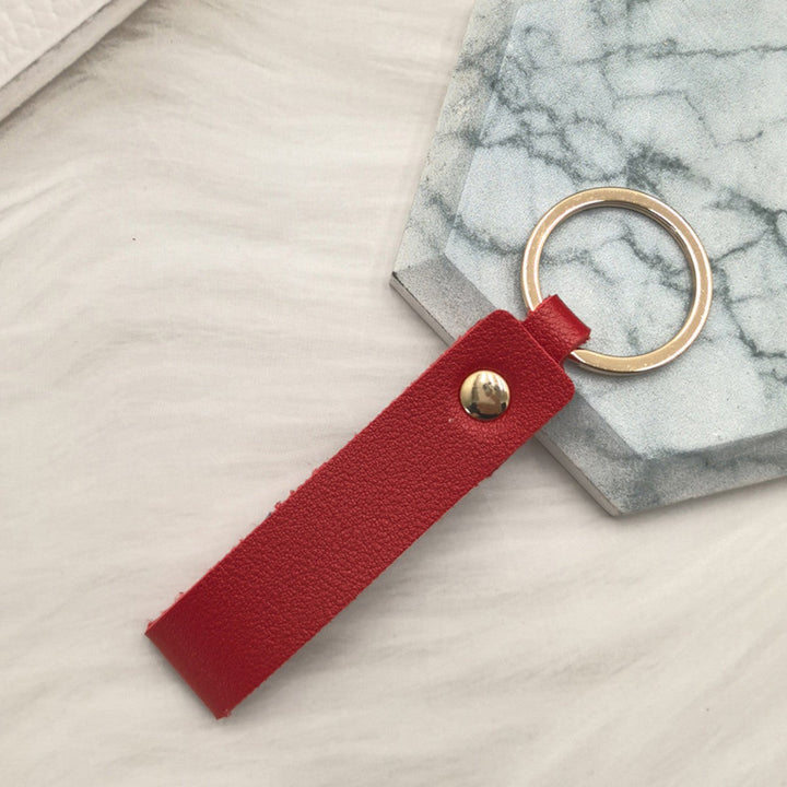 Unisex keychain made of high-quality synthetic leather with elegant metal embellishment Kalsten