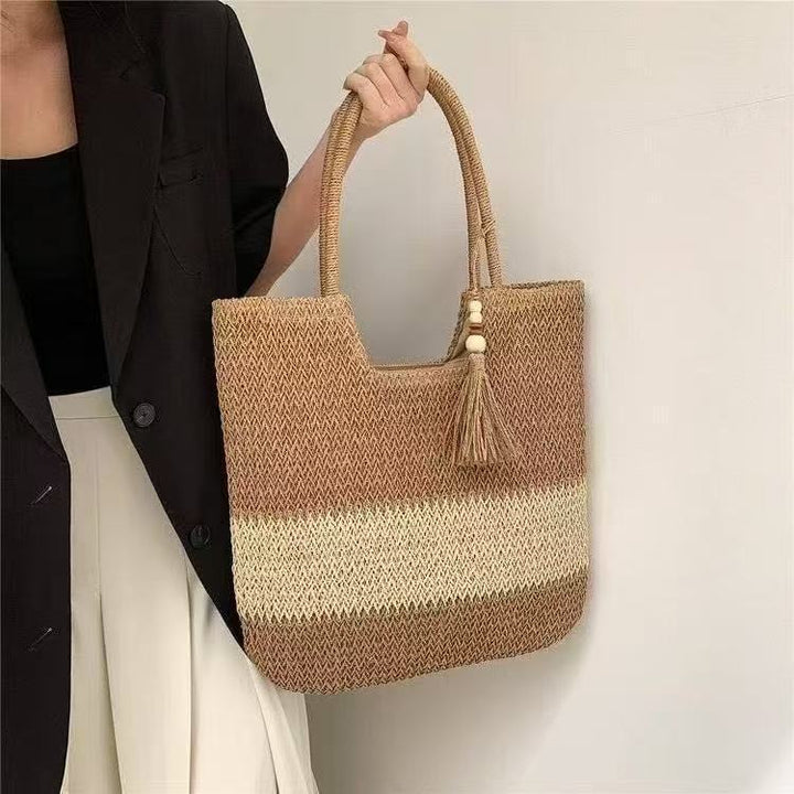 Handbag made of braided natural material with tassel details Kalsten