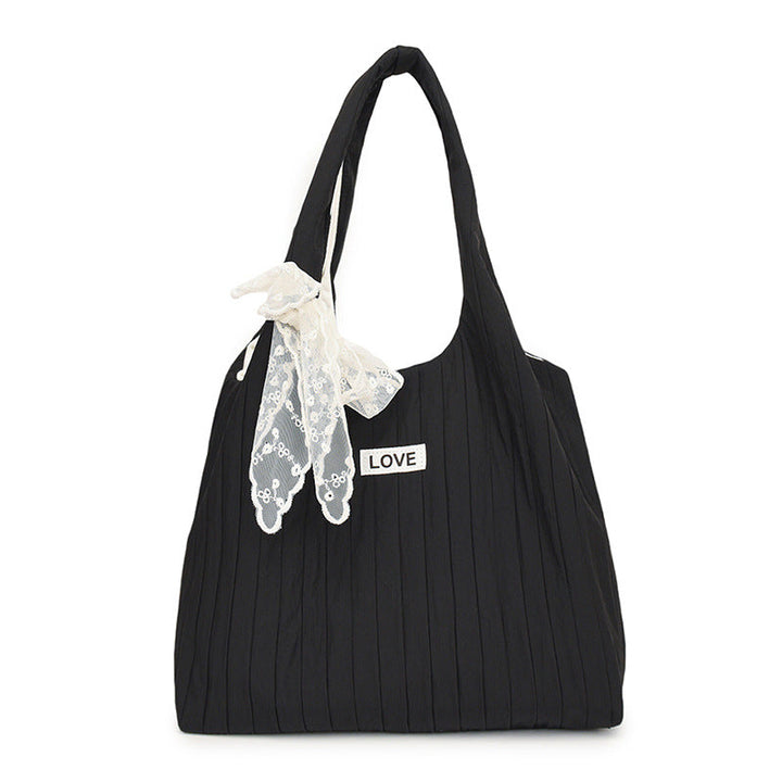 Leisure bag with structured design and playful scarf Kalsten