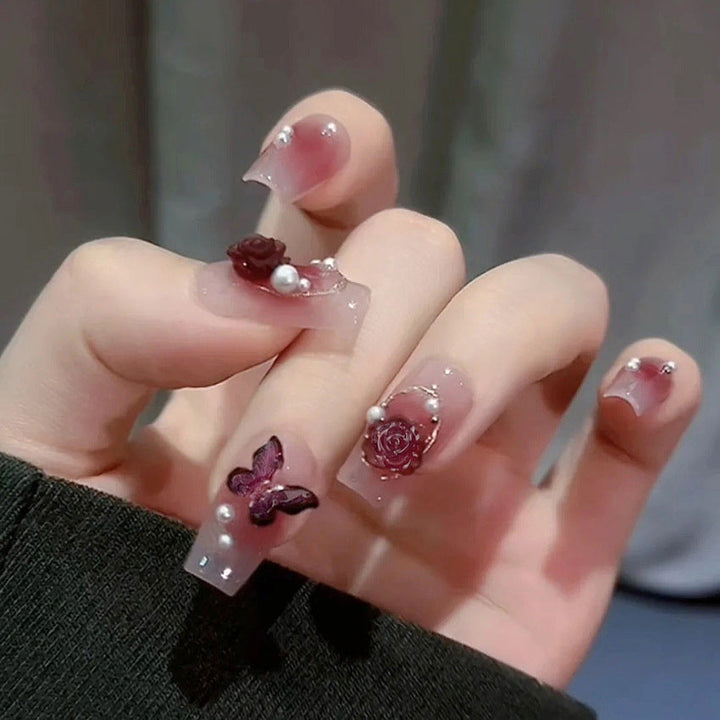 Glamorous artificial nails with delicate flower and glitter effects Kalsten