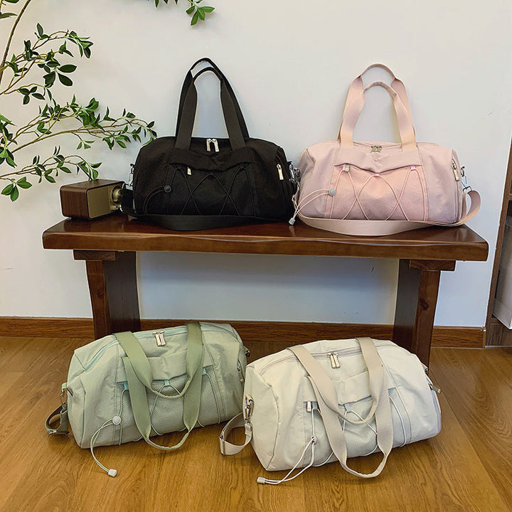 Sporty shoulder bag with adjustable carrying handles and breathable mesh material Kalsten
