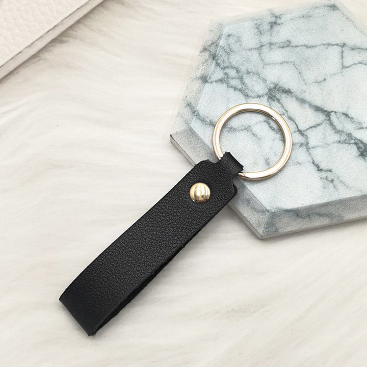 Unisex keychain made of high-quality synthetic leather with elegant metal embellishment Kalsten