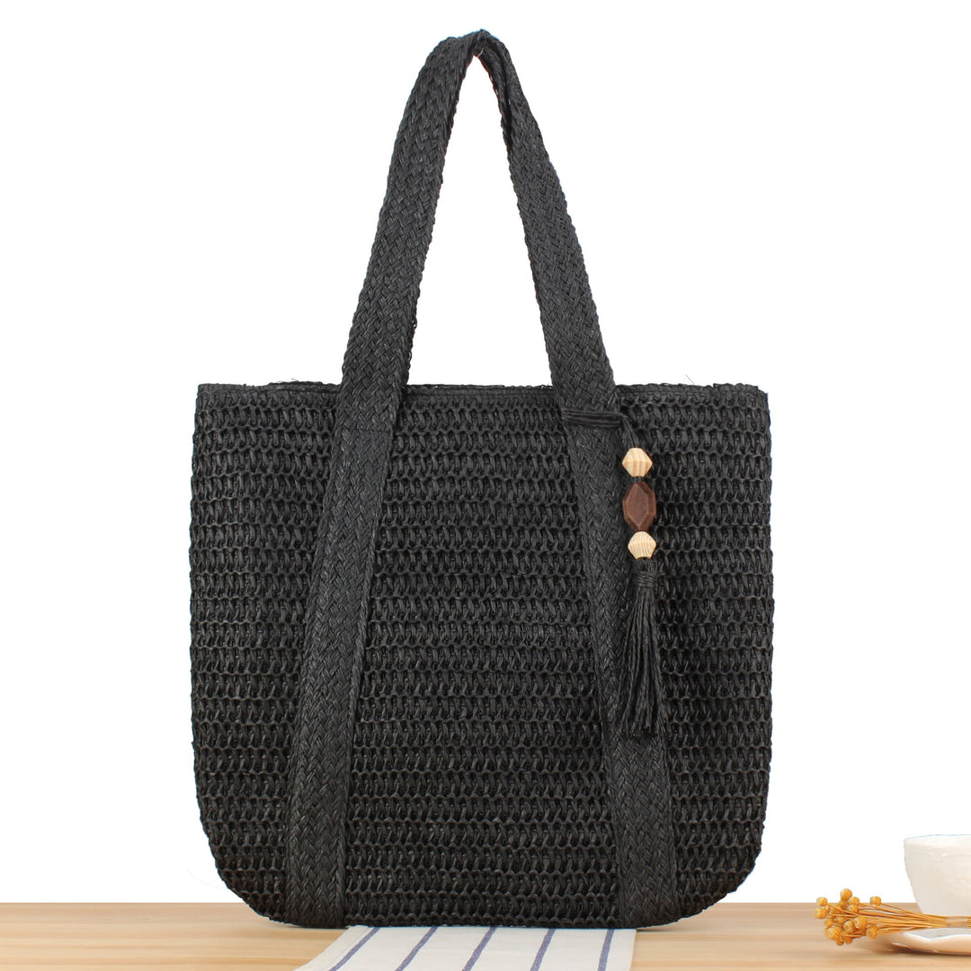 Eco-friendly straw tote bag with elegant tassel detail Kalsten