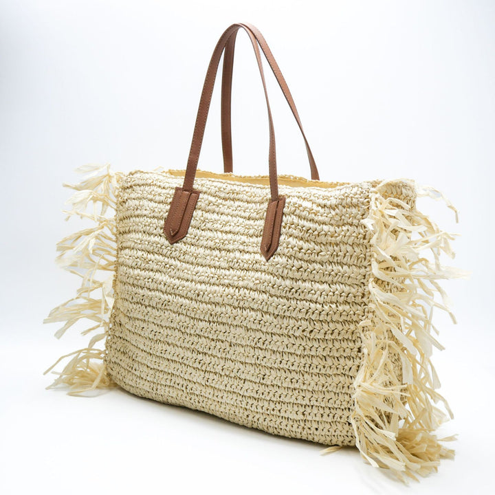 Beach bag made of handwoven straw with fringes Kalsten