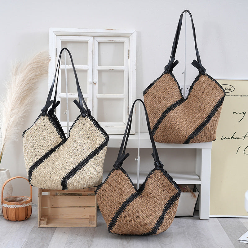 Handbag made of braided natural material with contrasting leather handles Kalsten