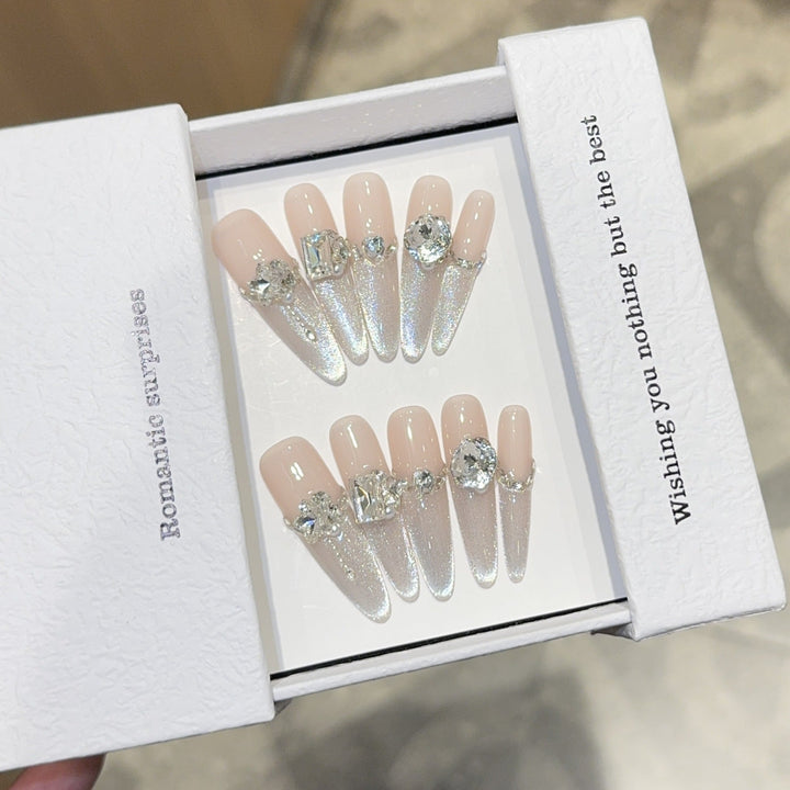 Glamorous artificial nails with sparkling rhinestone embellishments Kalsten