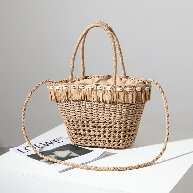 Braided straw bag with decorative tassel detail Kalsten