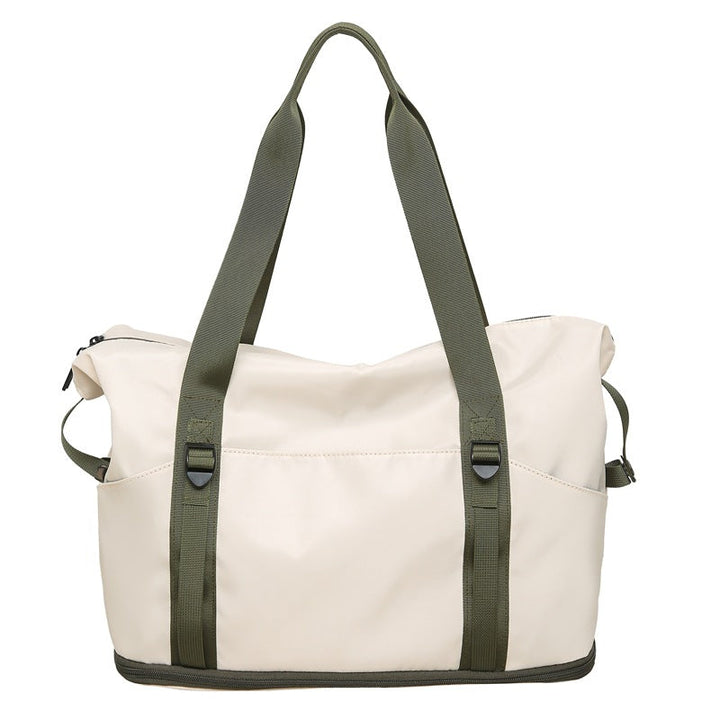 Sporty shoulder bag with water-repellent material and sturdy carrying handles Kalsten