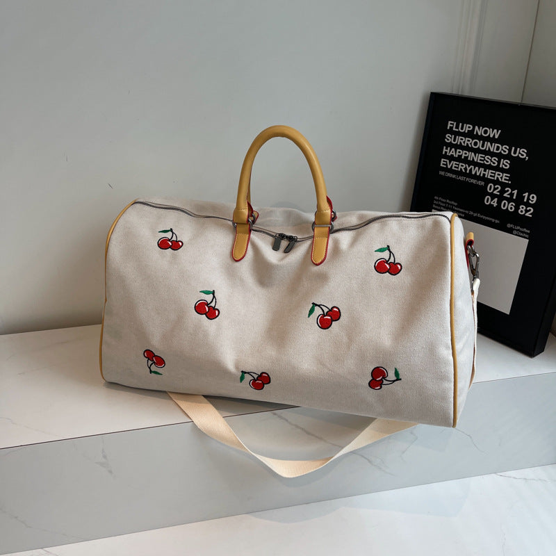 Sporty weekend bag with playful cherry pattern Kalsten