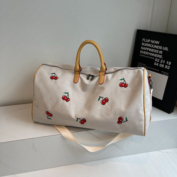 Sporty weekend bag with playful cherry pattern Kalsten