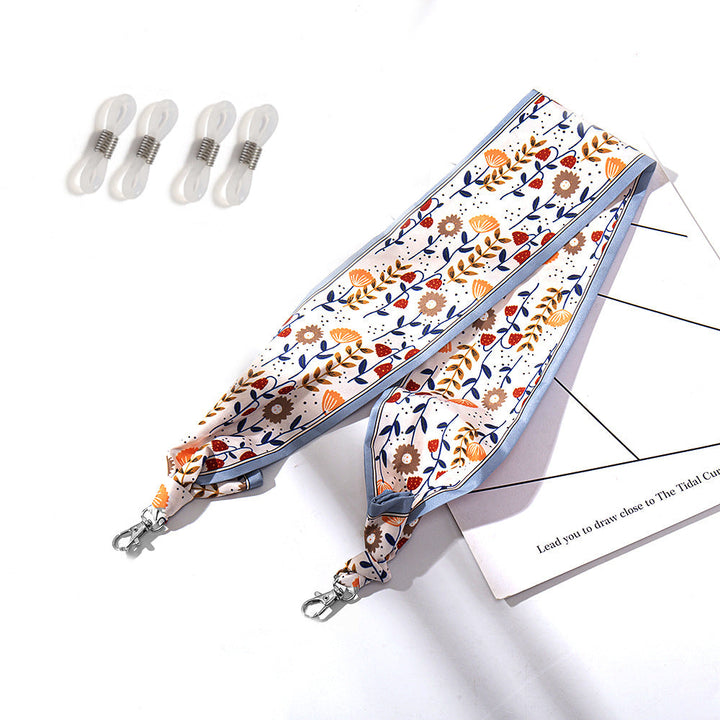 Fashionable fabric mask holder with floral motifs Kalsten