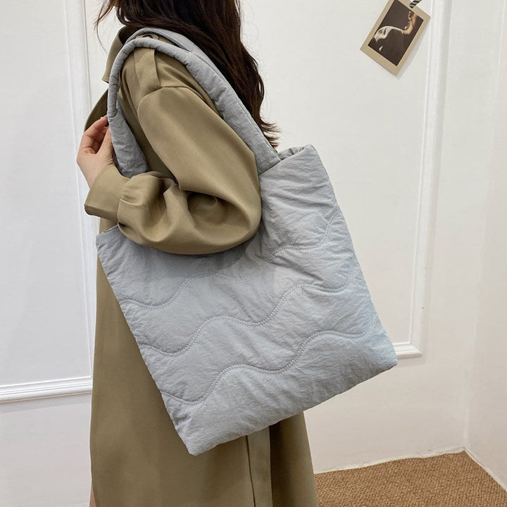 Padded shoulder bag with wave design Kalsten