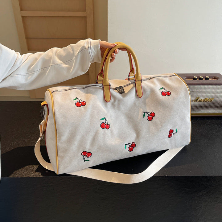 Sporty weekend bag with playful cherry pattern Kalsten