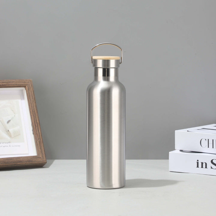 Women's stainless steel insulated drinking bottle with sustainable bamboo lid Kalsten