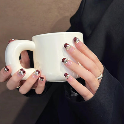 Glamorous artificial nails with decorative pearl and glitter embellishments Acalora