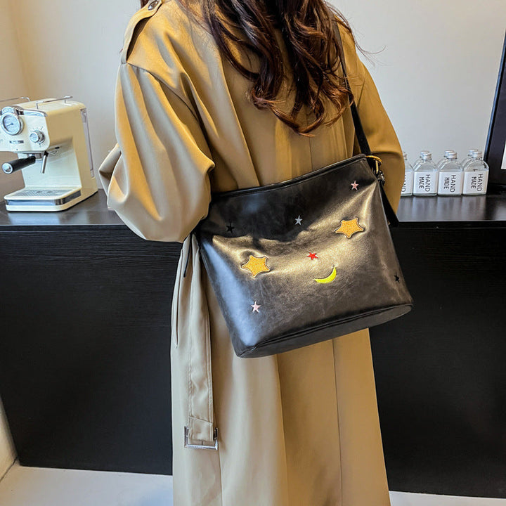 Shoulder bag with charming applications Kalsten