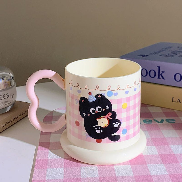 Ceramic mug with playful cat motif Kalsten